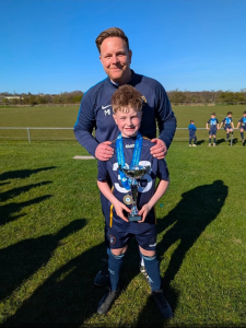 Matthew Ireland & Son William with the Garforth League U11's Cup
